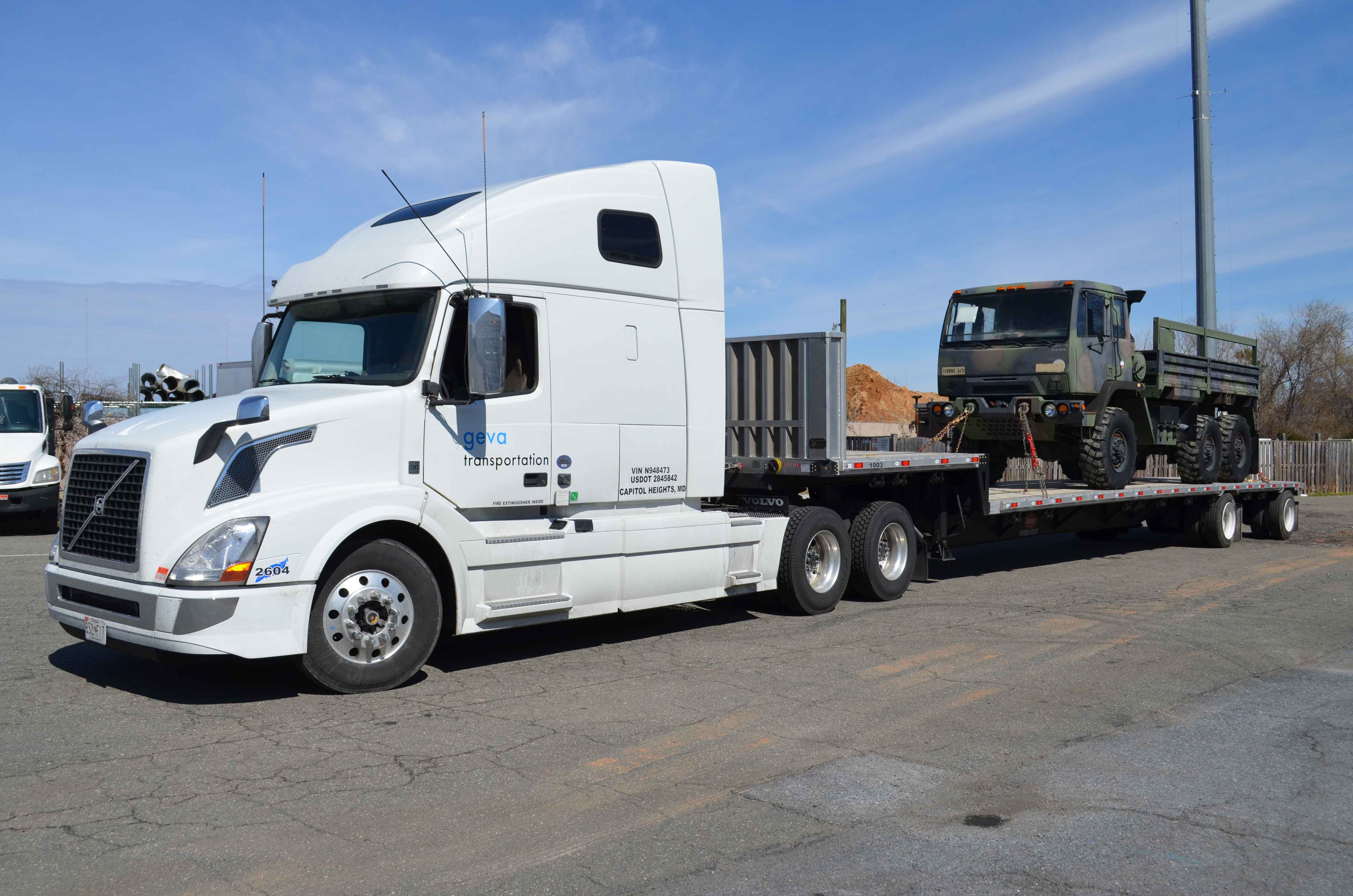 Geva trailer truck transporting military vehicle