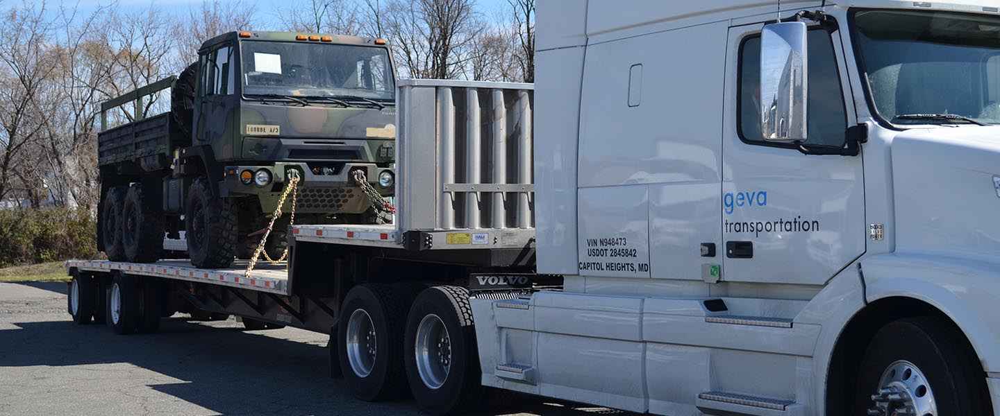 Geva truck carrying military vehicle