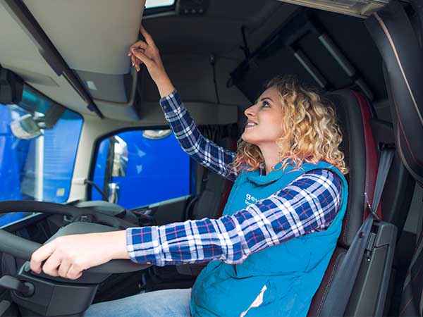 Woman driving Geva logistics truck