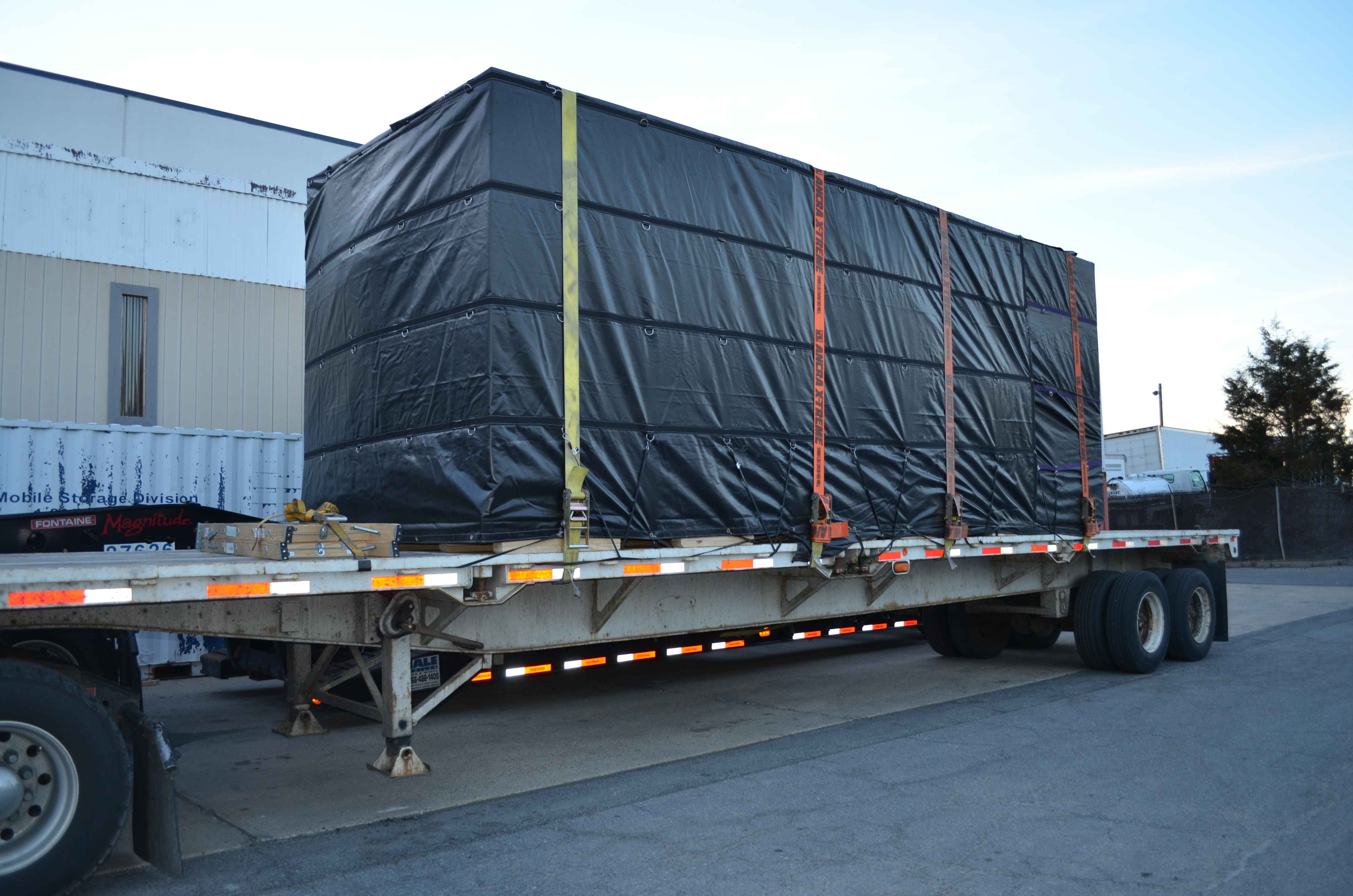 storage container secured to truck trailer