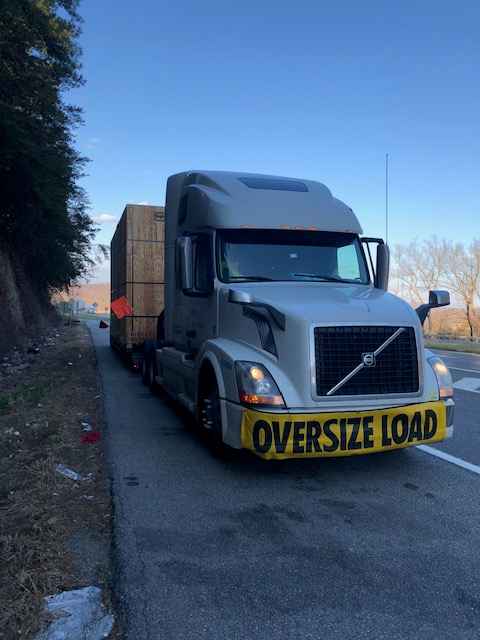 Geva trailer truck with oversize load warning sign